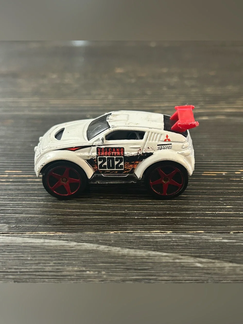 Volcano Shooters 202 White Toy Race Car with Red Wheels